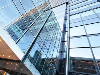 Exterior view of an all glass high-rise building 